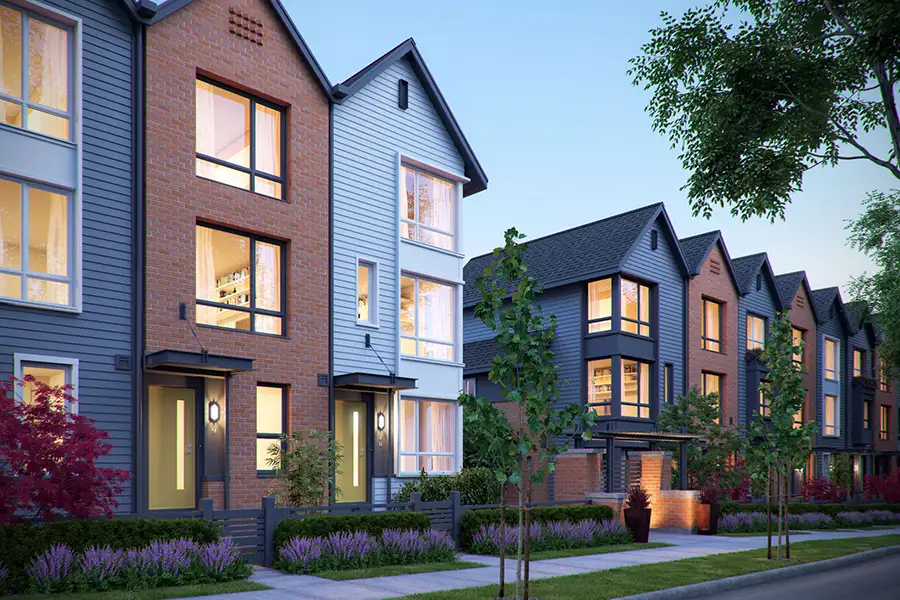 Rendering of attached townhomes with large windows and pitched roofs.