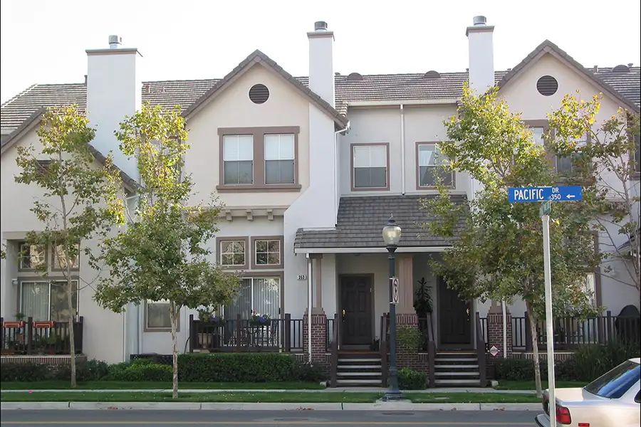 Attached townhomes abutting the street.